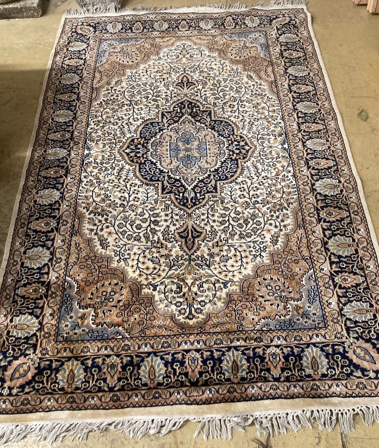 A red multi medallion Persian wool rug, 236 x 154cm